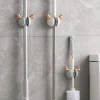 Creative cartoon mop hook, wall-mounted fixed snap-on storage rack, hanging rack, no-hole broom clamp, bathroom hook Application Scenario